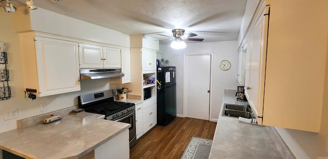 1000 Waverly Rd, Mountain Home, AR 72653 - kitchen with stainless steel range with gas cooktop, ventilation hood, freestanding refrigerator, ceiling fan, and dark wood finished floors