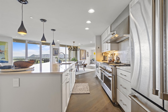 3700 Cantrell Rd Unit 1002, Little Rock, AR 72202 - kitchen featuring stainless steel appliances, light countertops, white cabinets, recessed lighting, and hanging light fixtures