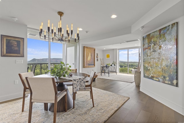 3700 Cantrell Rd Unit 1002, Little Rock, AR 72202 - dining space featuring a chandelier, wood finished floors, recessed lighting, and a mountain view