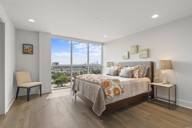 3700 Cantrell Rd Unit 1002, Little Rock, AR 72202 - bedroom featuring expansive windows, wood finished floors, a city view, and recessed lighting