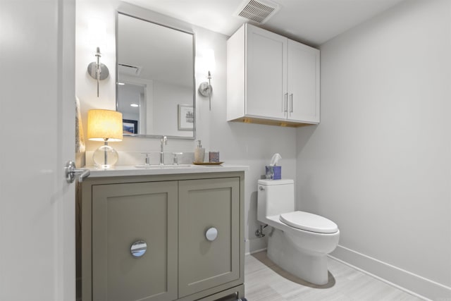 3700 Cantrell Rd Unit 1002, Little Rock, AR 72202 - half bath featuring baseboards and vanity