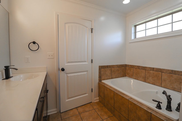 bathroom with a garden tub, vanity, tile patterned flooring, and crown molding