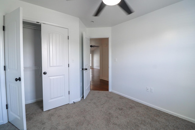 unfurnished bedroom with a closet, carpet floors, and ceiling fan