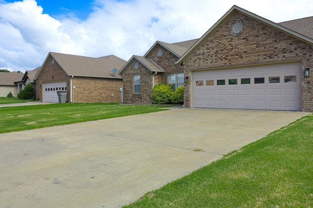view of front facade featuring brick siding, a front lawn, concrete driveway, roof with shingles, and a garage