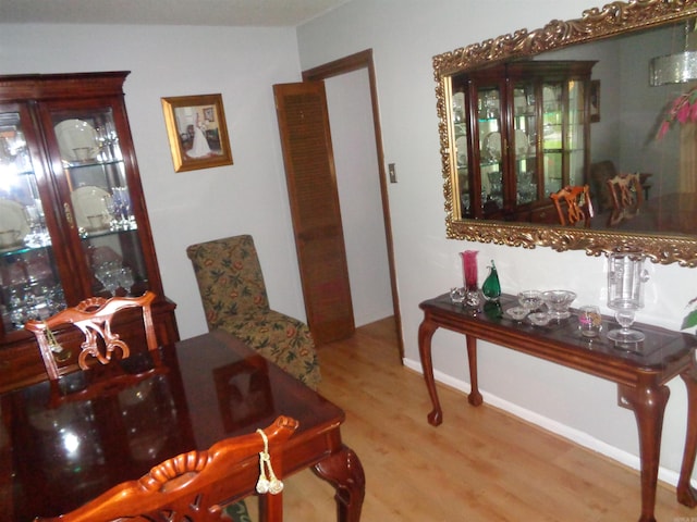 2 Wellington Ct, Little Rock, AR 72227 - dining room with wood finished floors and baseboards