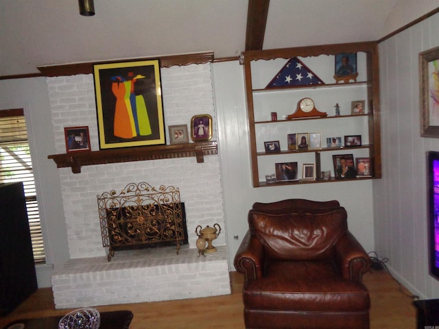2 Wellington Ct, Little Rock, AR 72227 - living room with a brick fireplace and wood finished floors