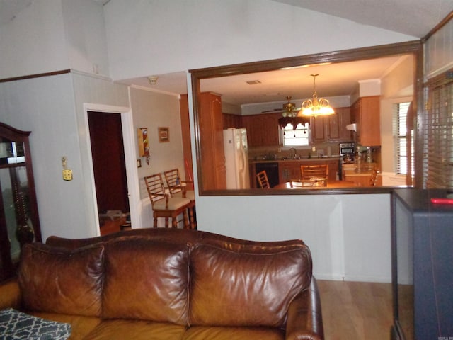 2 Wellington Ct, Little Rock, AR 72227 - living area with a chandelier, wood finished floors, and high vaulted ceiling