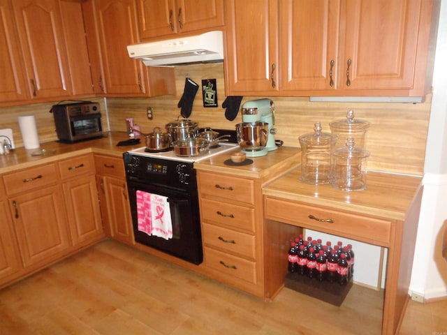 2 Wellington Ct, Little Rock, AR 72227 - kitchen featuring under cabinet range hood, black range with electric stovetop, light wood-style floors, and tasteful backsplash
