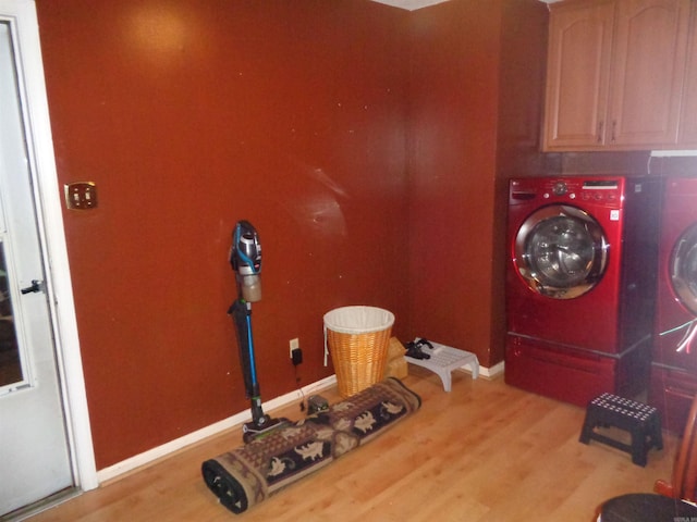 2 Wellington Ct, Little Rock, AR 72227 - laundry area featuring cabinet space, wood finished floors, and washer and dryer