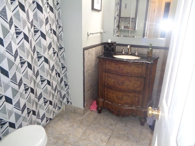 2 Wellington Ct, Little Rock, AR 72227 - bathroom featuring vanity, tile walls, tile patterned flooring, a shower with shower curtain, and wainscoting