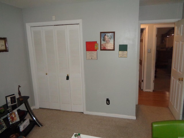 2 Wellington Ct, Little Rock, AR 72227 - carpeted bedroom with a closet and baseboards