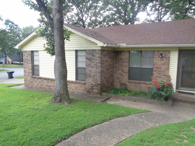 2 Wellington Ct, Little Rock, AR 72227 - view of side of property featuring brick siding, a lawn, and a shingled roof