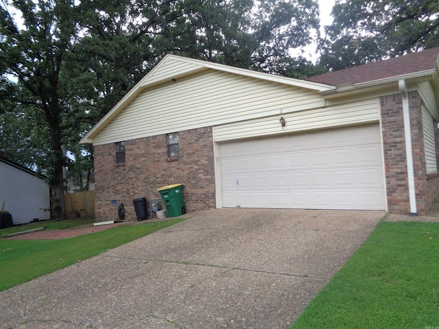 2 Wellington Ct, Little Rock, AR 72227 - view of property exterior with brick siding, asphalt driveway, and an attached garage