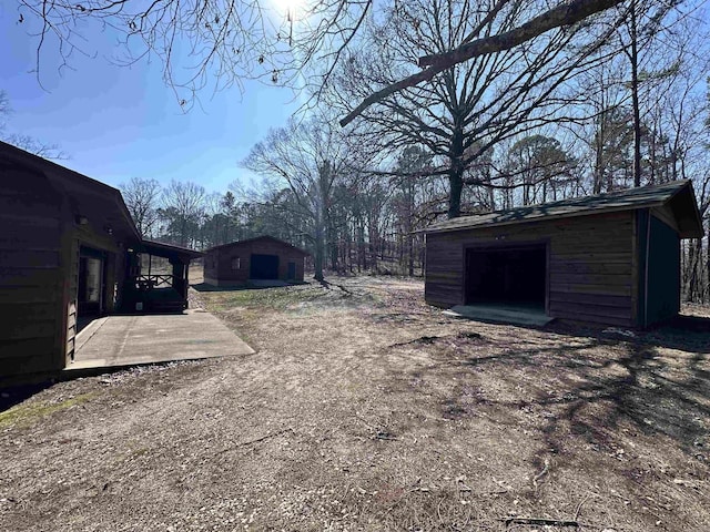 view of yard featuring a deck and a shed