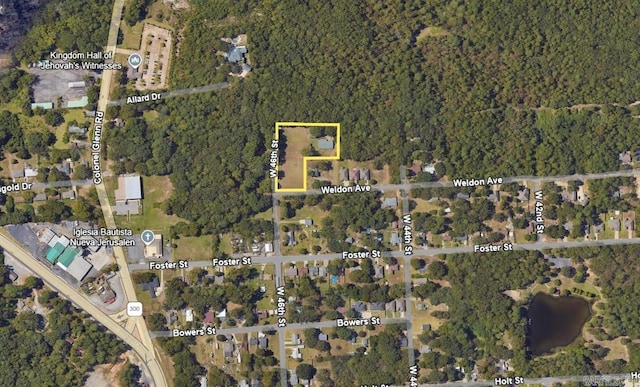 aerial map of property and surrounding area featuring property boundaries highlighted