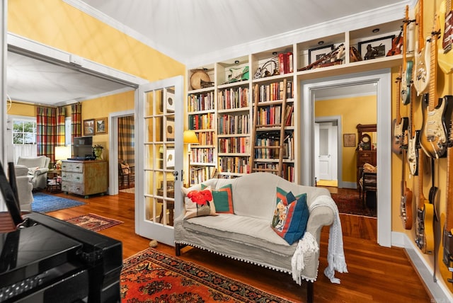 445 Midland St, Little Rock, AR 72205 - living area with crown molding, wood finished floors, and built in shelves