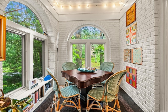 445 Midland St, Little Rock, AR 72205 - dining room with brick wall, track lighting, and wood finished floors