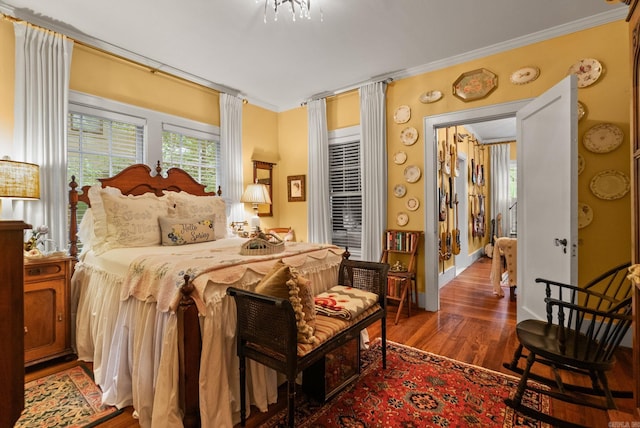 445 Midland St, Little Rock, AR 72205 - bedroom featuring dark wood-style flooring and crown molding