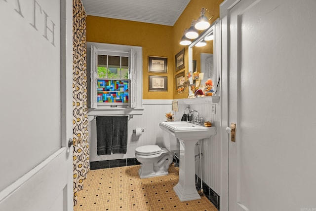 445 Midland St, Little Rock, AR 72205 - half bath featuring a wainscoted wall and toilet