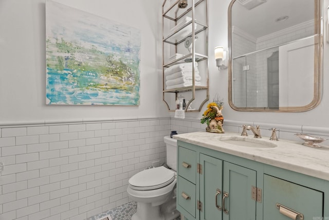 445 Midland St, Little Rock, AR 72205 - full bathroom with vanity, crown molding, an enclosed shower, tile walls, and a wainscoted wall