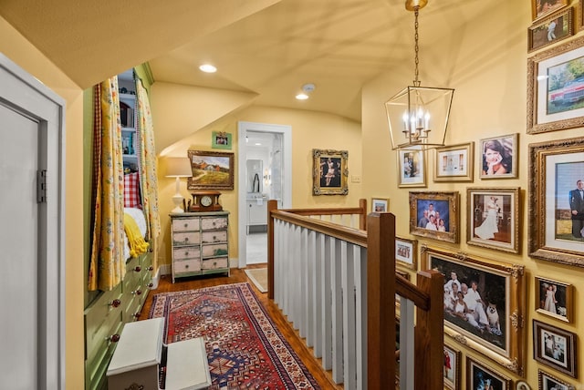 445 Midland St, Little Rock, AR 72205 - hall featuring an upstairs landing, a chandelier, recessed lighting, and wood finished floors