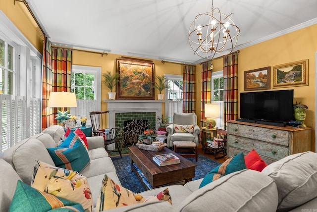 445 Midland St, Little Rock, AR 72205 - living room featuring ornamental molding, a chandelier, and a tile fireplace
