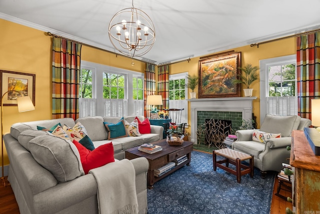 445 Midland St, Little Rock, AR 72205 - living room featuring ornamental molding, a chandelier, wood finished floors, and a tiled fireplace