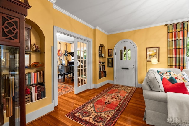 445 Midland St, Little Rock, AR 72205 - entryway featuring wood finished floors, ornamental molding, and arched walkways
