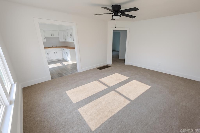8200 W 34th St, Little Rock, AR 72204 - empty room with light carpet and ceiling fan