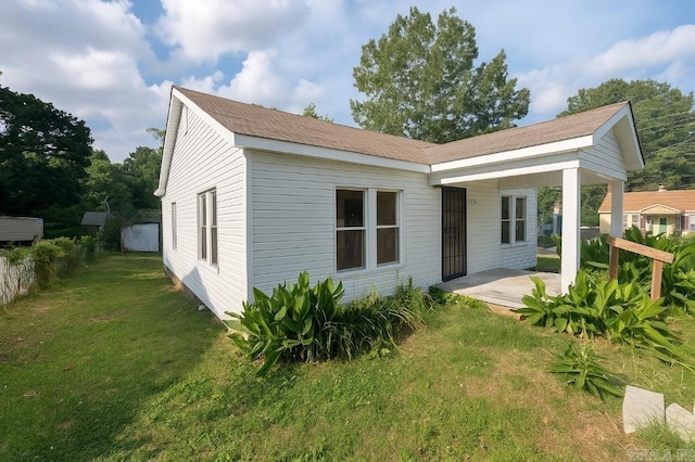 8200 W 34th St, Little Rock, AR 72204 - rear view of property featuring a yard and a patio