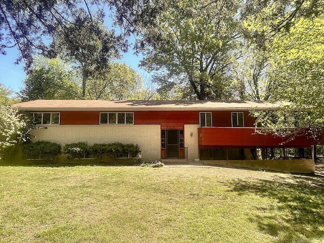 203 Richwood Dr, Mountain Home, AR 72653 - raised ranch featuring brick siding and a front lawn