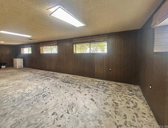 203 Richwood Dr, Mountain Home, AR 72653 - spare room with wooden walls and a textured ceiling