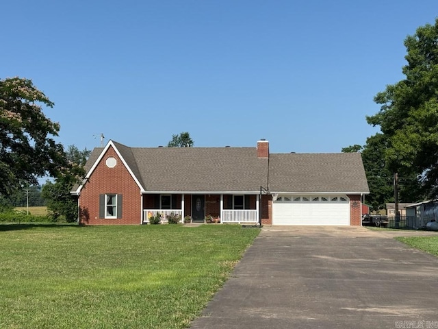 205 Westwood Dr, Marshall, AR 72650 - view of front facade featuring covered porch, driveway, brick siding, a garage, and a front lawn