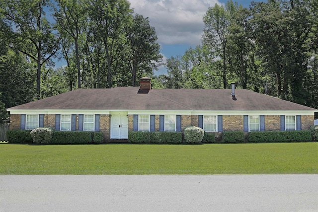 6 Elaine Rd, Sheridan, AR 72150 - single story home featuring a front lawn, brick siding, and a chimney