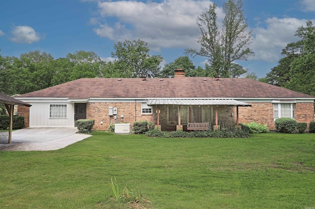 6 Elaine Rd, Sheridan, AR 72150 - rear view of property featuring a patio area, a yard, brick siding, and a chimney