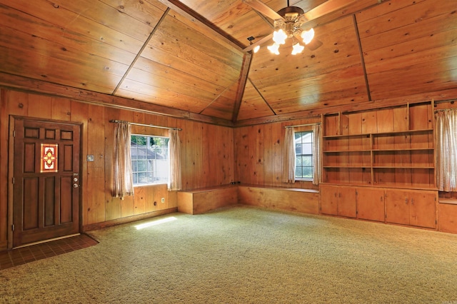 6 Elaine Rd, Sheridan, AR 72150 - carpeted empty room featuring ceiling fan, wooden ceiling, plenty of natural light, and wood walls