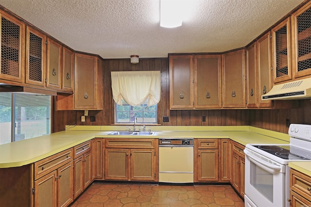 6 Elaine Rd, Sheridan, AR 72150 - kitchen featuring white appliances, under cabinet range hood, a textured ceiling, light countertops, and healthy amount of natural light