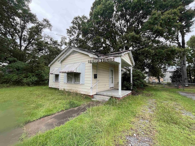 view of side of home featuring a porch