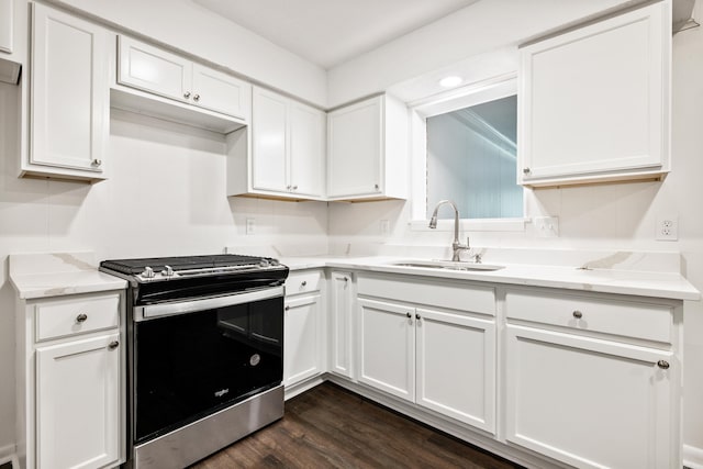 10301 Milkyway Dr, Little Rock, AR 72209 - kitchen with stainless steel gas range, white cabinets, dark wood-style floors, and light stone countertops