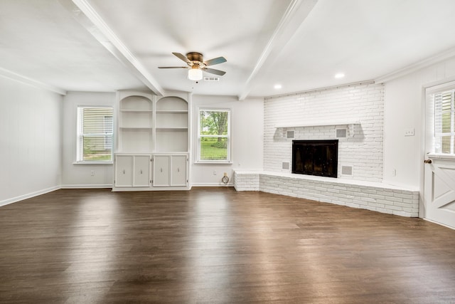 10301 Milkyway Dr, Little Rock, AR 72209 - unfurnished living room with beam ceiling, dark wood-type flooring, a ceiling fan, healthy amount of natural light, and ornamental molding