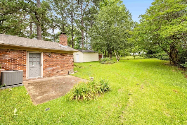 10301 Milkyway Dr, Little Rock, AR 72209 - view of green lawn with a patio area