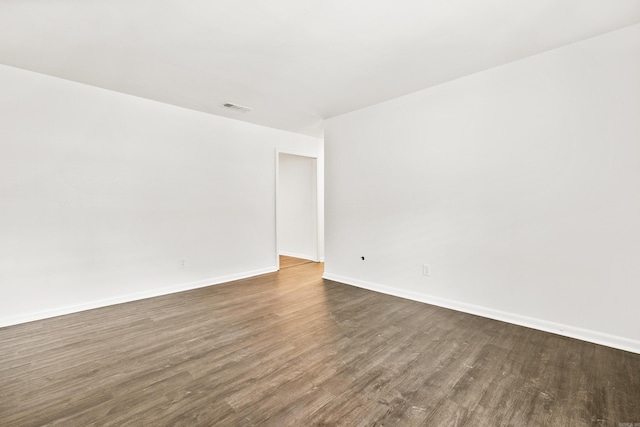 10301 Milkyway Dr, Little Rock, AR 72209 - unfurnished room with dark wood-type flooring and baseboards