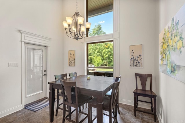 909 Nature Way, Benton, AR 72019 - dining area featuring a high ceiling and a chandelier