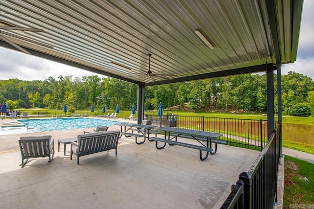 909 Nature Way, Benton, AR 72019 - view of patio / terrace with a community pool, ceiling fan, and view of scattered trees