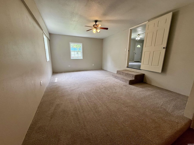 131 N Pine St, Salem, AR 72576 - carpeted empty room with a ceiling fan