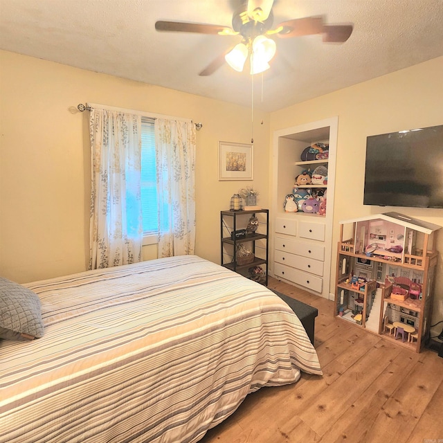 1407 W Front St, Heber Springs, AR 72543 - bedroom with wood finished floors and ceiling fan