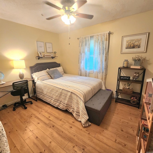 1407 W Front St, Heber Springs, AR 72543 - bedroom with light wood-type flooring and a ceiling fan