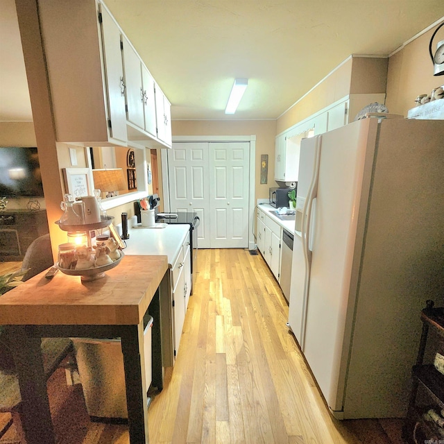 1407 W Front St, Heber Springs, AR 72543 - kitchen featuring white fridge with ice dispenser, light wood finished floors, dishwasher, and white cabinetry