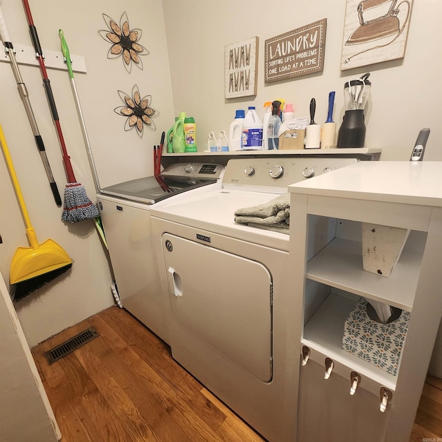 1407 W Front St, Heber Springs, AR 72543 - laundry room featuring wood finished floors and washer and dryer
