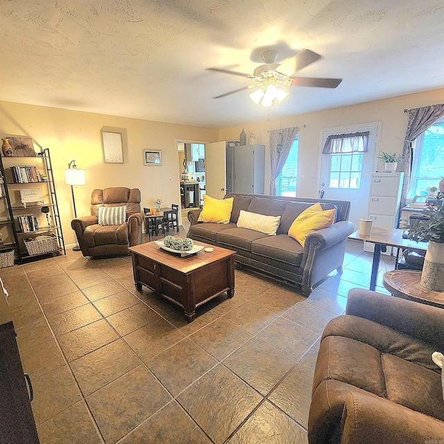 1407 W Front St, Heber Springs, AR 72543 - living room featuring a ceiling fan and tile patterned flooring